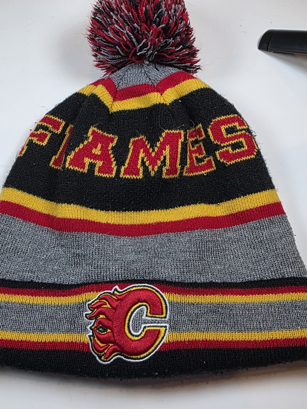 Calgary Flames NHL Knit Pom Beanie Toque Gray Red Yellow Black